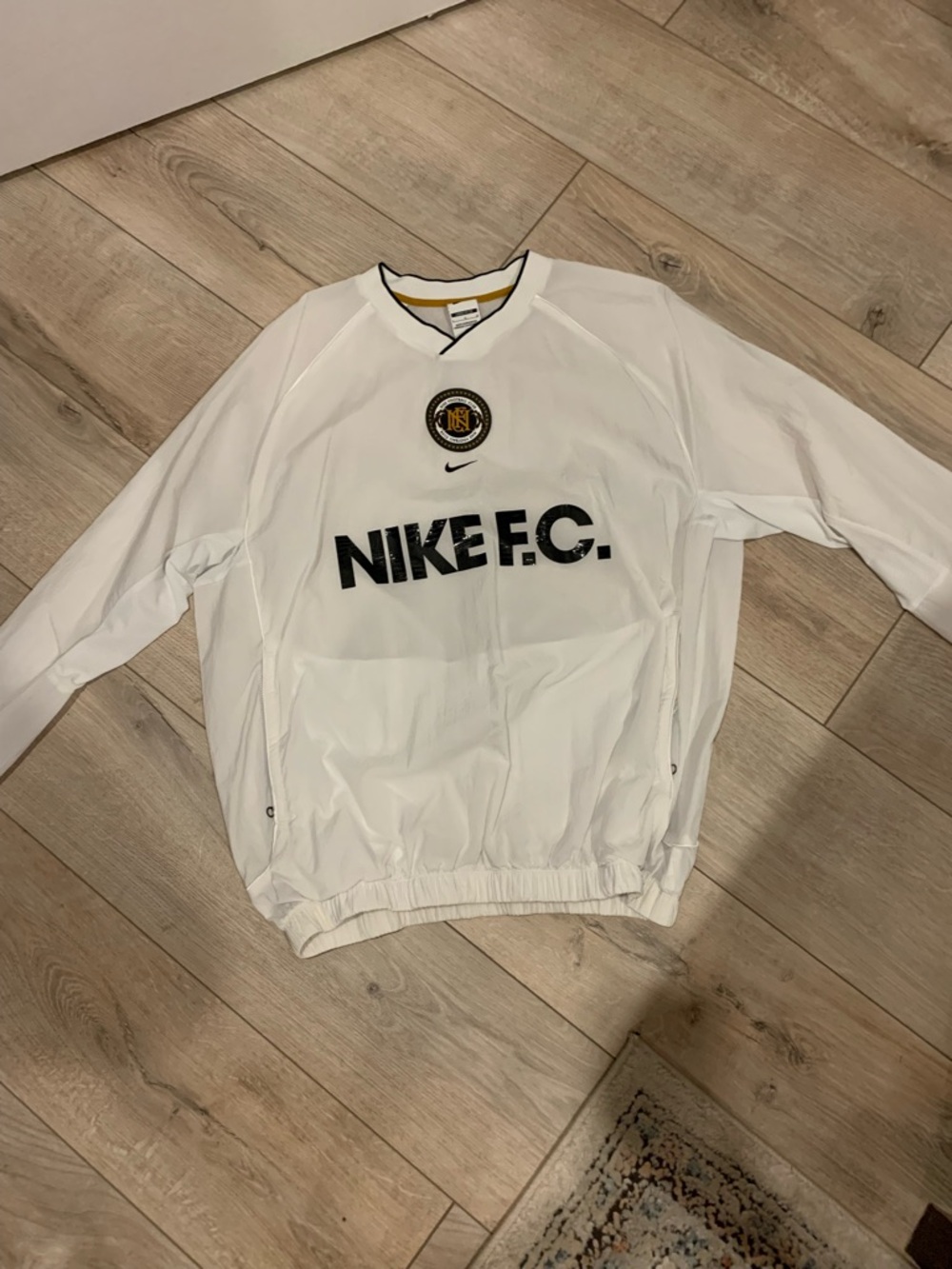 Nike White Pullover with Black and Gold F.C. Crest